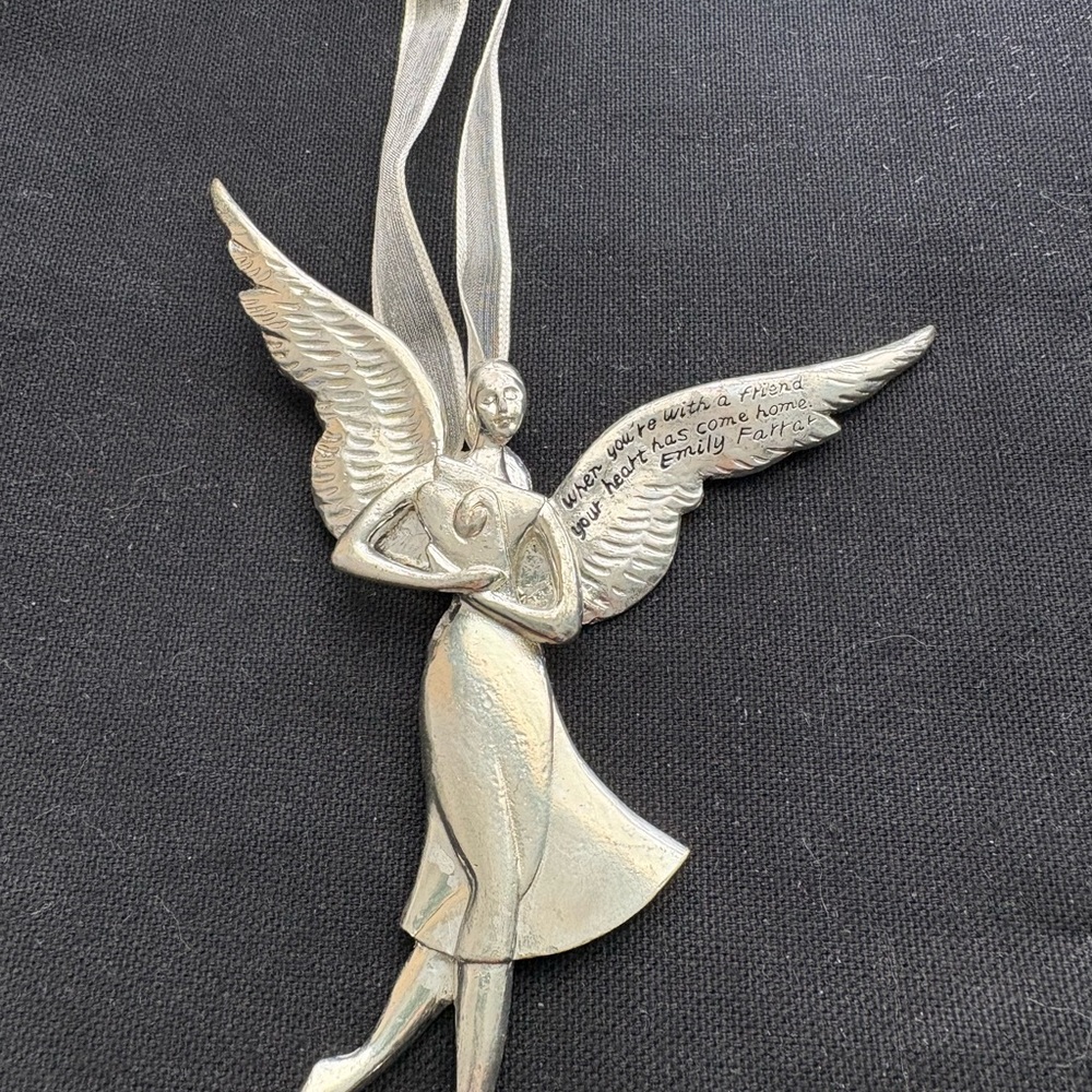 Silver love friend angel with saying on back. 6”.